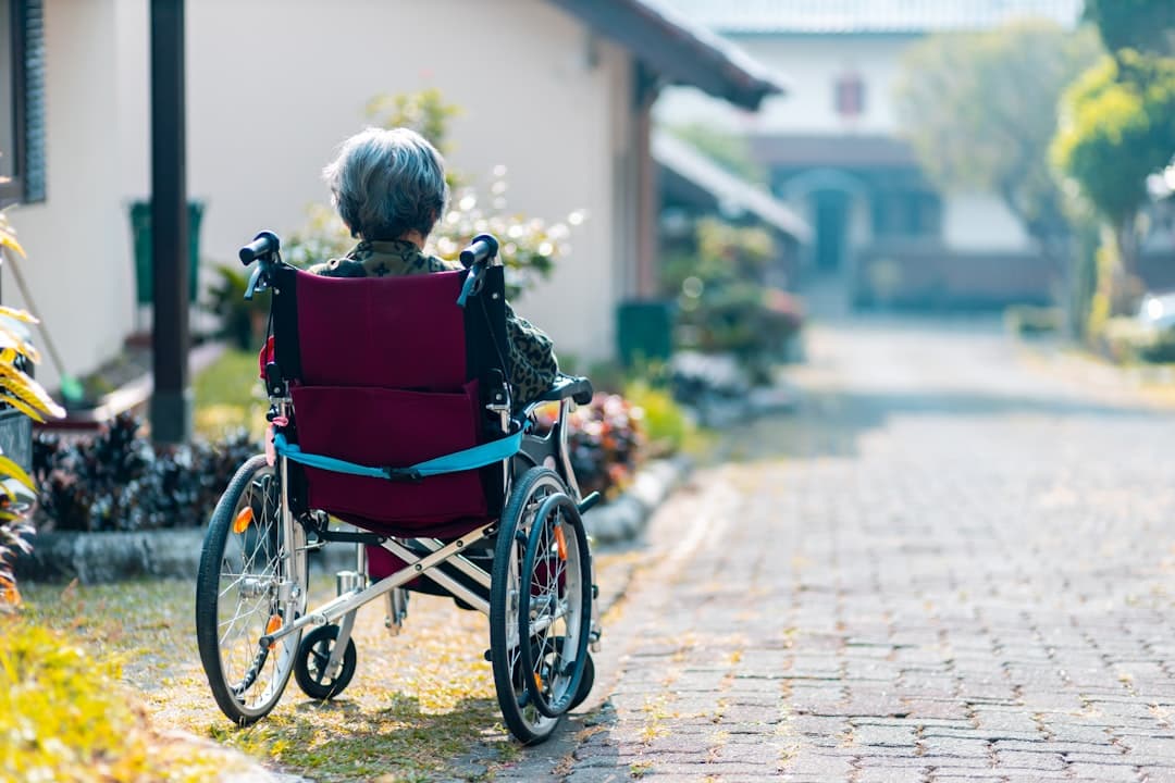 Wheelchair user at an accessible building entrance