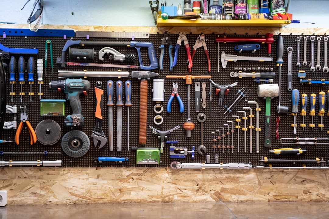 Service technician's tool wall with mixed-brand repair equipment